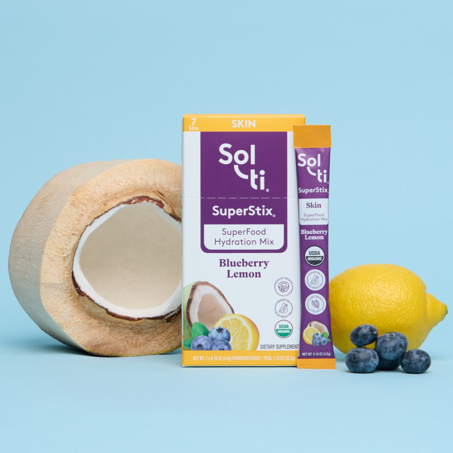 Sol-ti SuperStix Blueberry Lemon box front with stick angled on blue background, with coconut, lemon, and blueberries