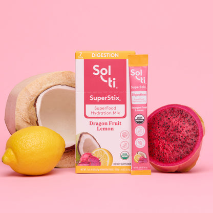 Sol-ti SuperStix Dragon Fruit Lemon box front with stick angled on pink background, with coconut, lemon, and dragon fruit