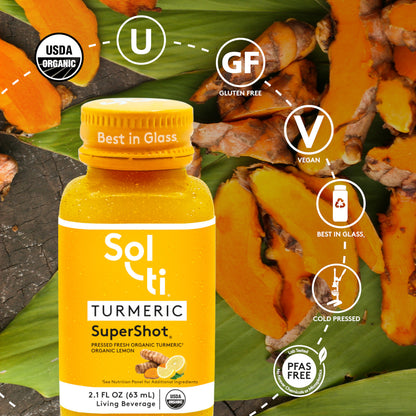 TURMERIC SuperShot bottle with front label on green leaves background, showing turmeric root, with logo benefits: USDA Organic, kosher, Gluten Free, Vegan, Best in Glass, Cold pressed and Lab tested No forever Chemicals or microplastics